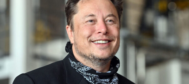 Smiling portrait of Elon Musk.